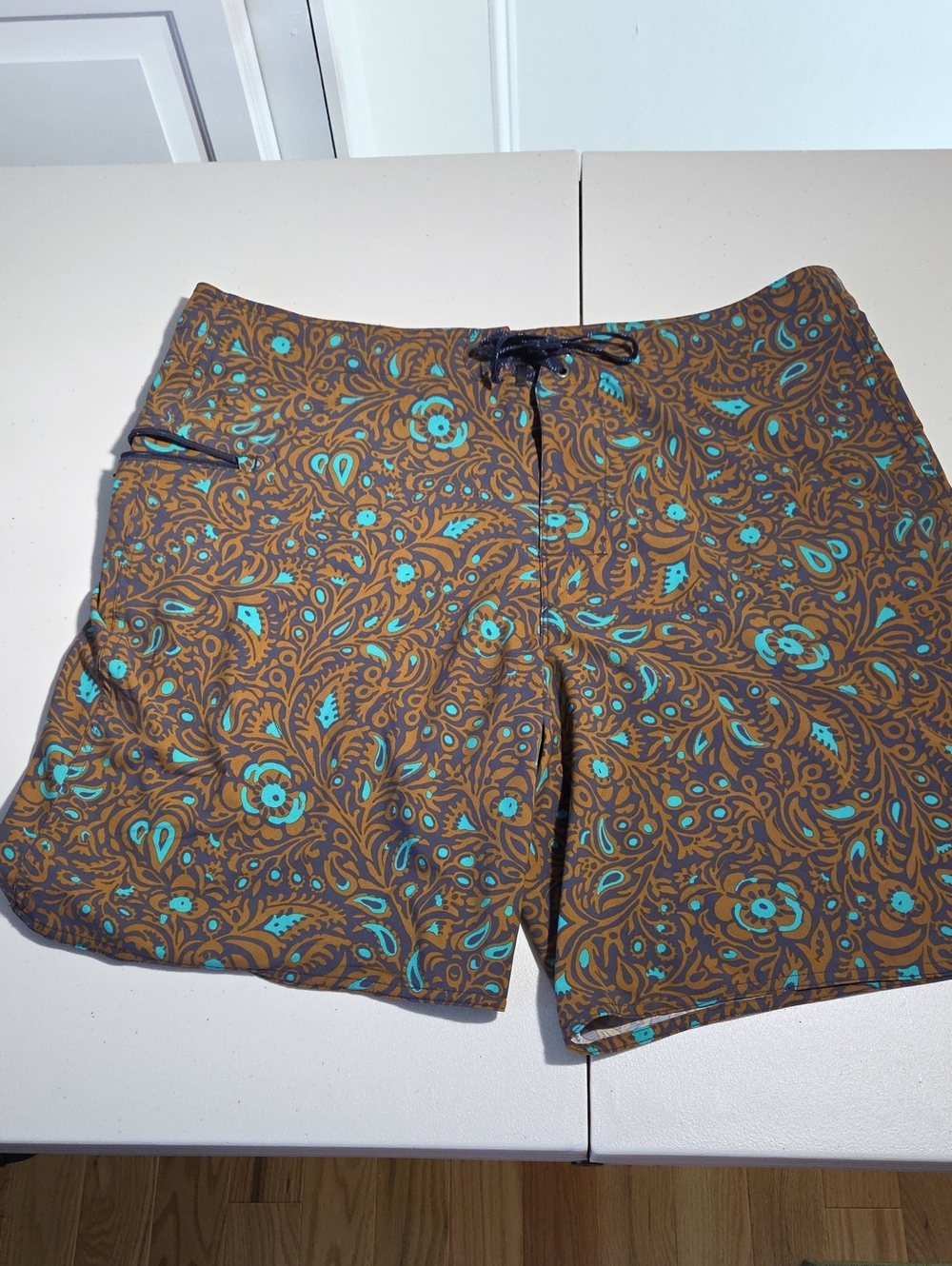 Patagonia Brown Swim Shorts with Teal Floral Print